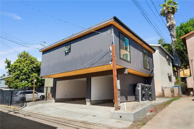 a front view of a building with garden