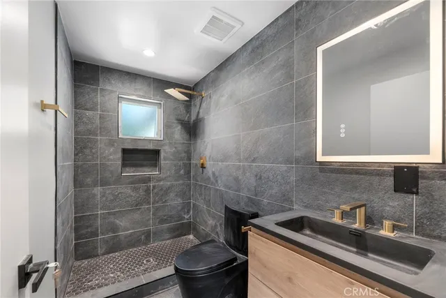a bathroom with a sink and toilet