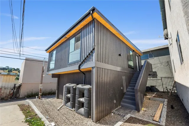 a view of a house with stairs and furniture