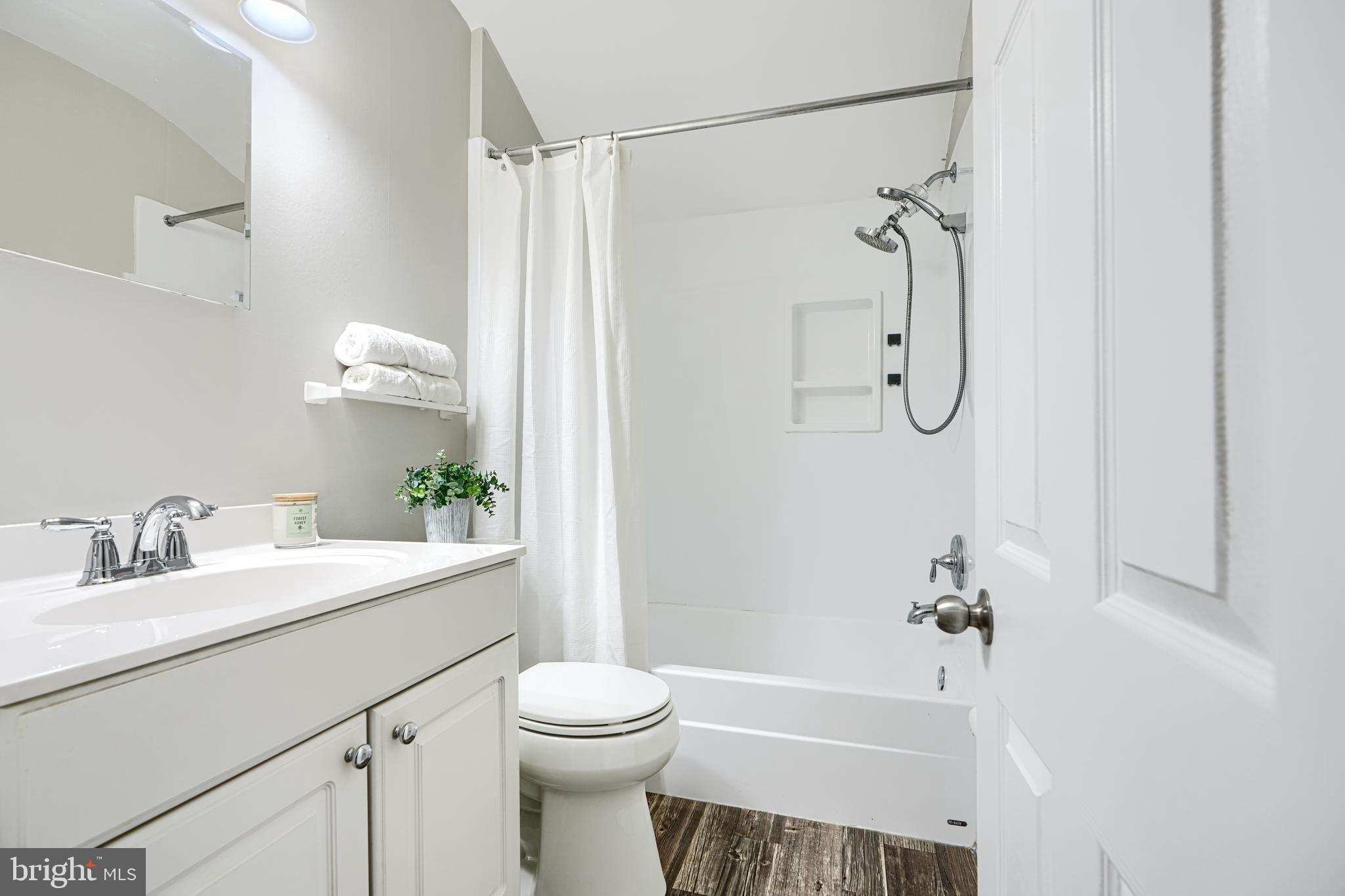 1620 Naturo Road Towson, MD 21286 - Photo 15 of 43 a bathroom with a sink a toilet and shower
