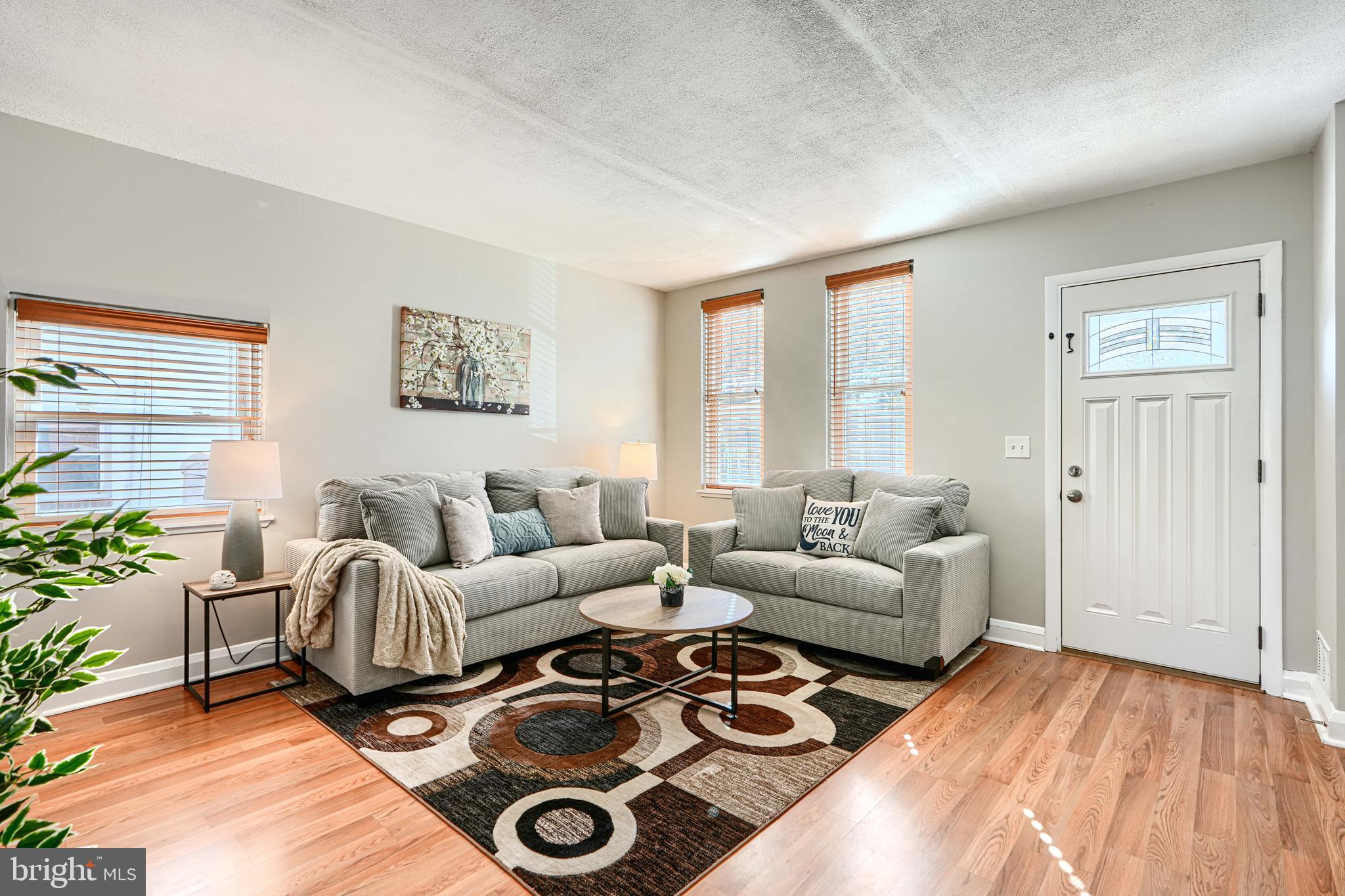 1620 Naturo Road Towson, MD 21286 - Photo 2 of 43 a living room with furniture and a wooden floor