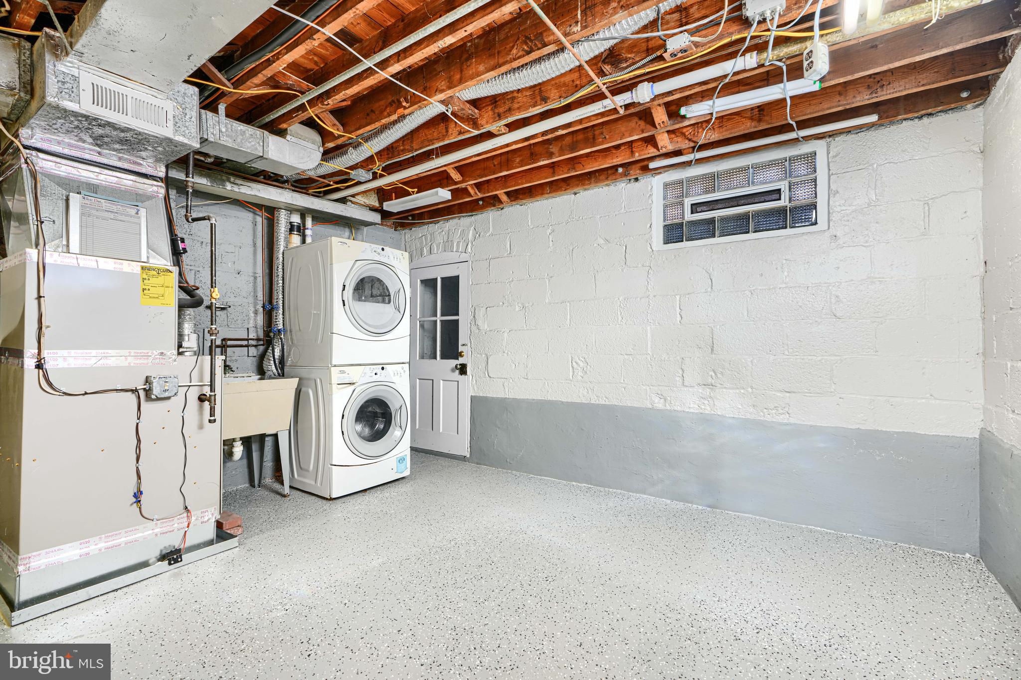 1620 Naturo Road Towson, MD 21286 - Photo 27 of 43 a view of a storage & utility room with washer and dryer