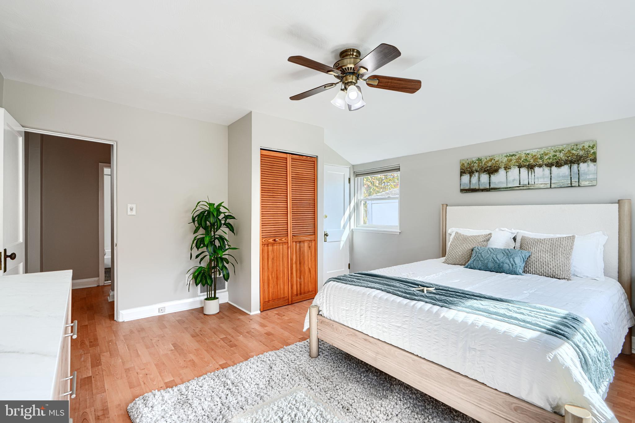 1620 Naturo Road Towson, MD 21286 - Photo 10 of 43 a bedroom with a bed and a potted plant