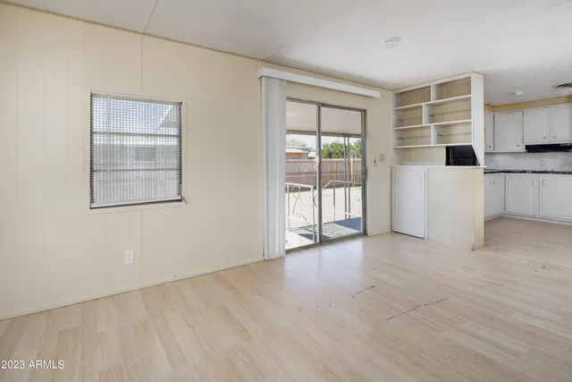 a view of an empty room with a window