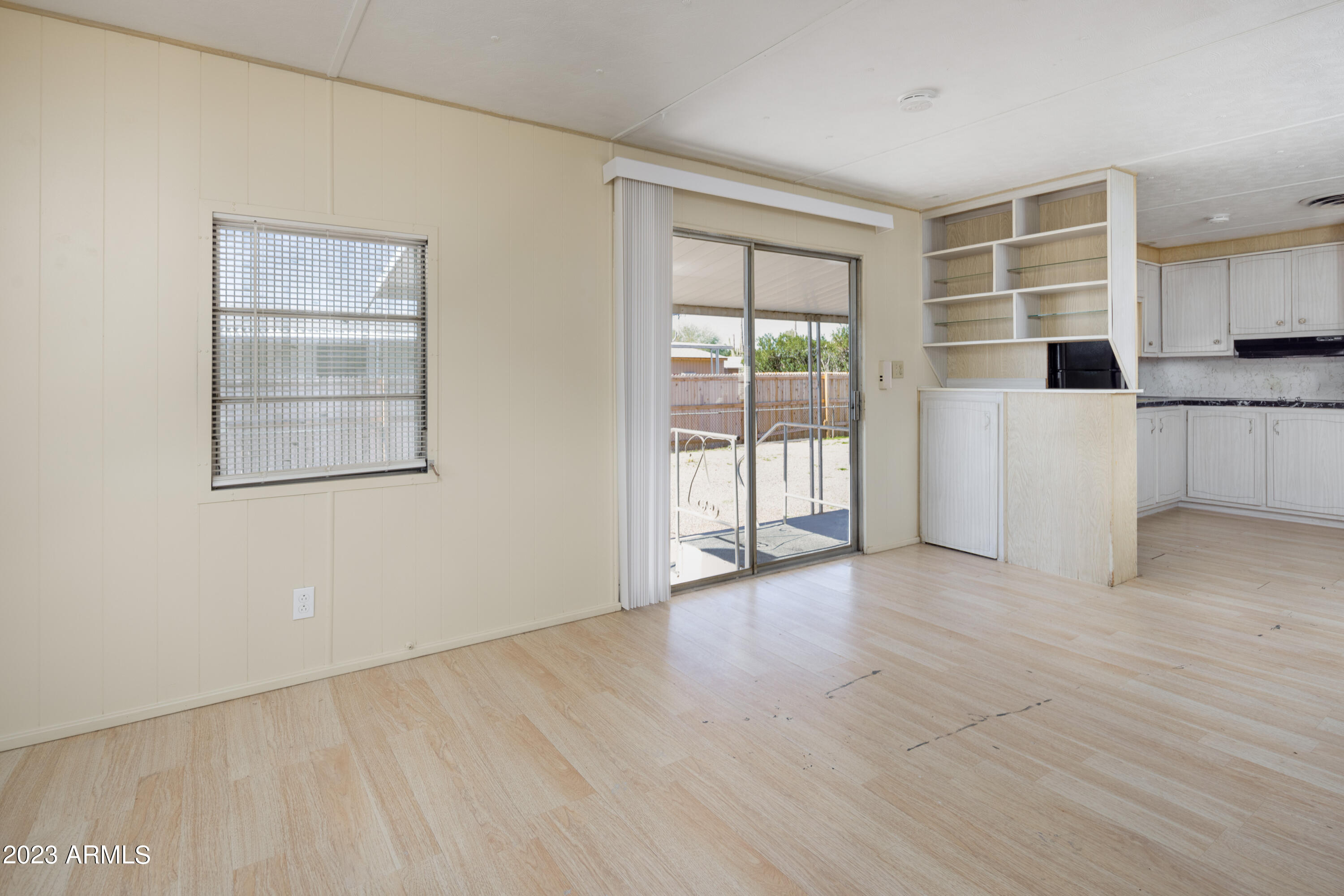 9618 East Aspen Circle Mesa, AZ 85208 - Photo 10 of 30 an empty room with a cabinet and mirrors