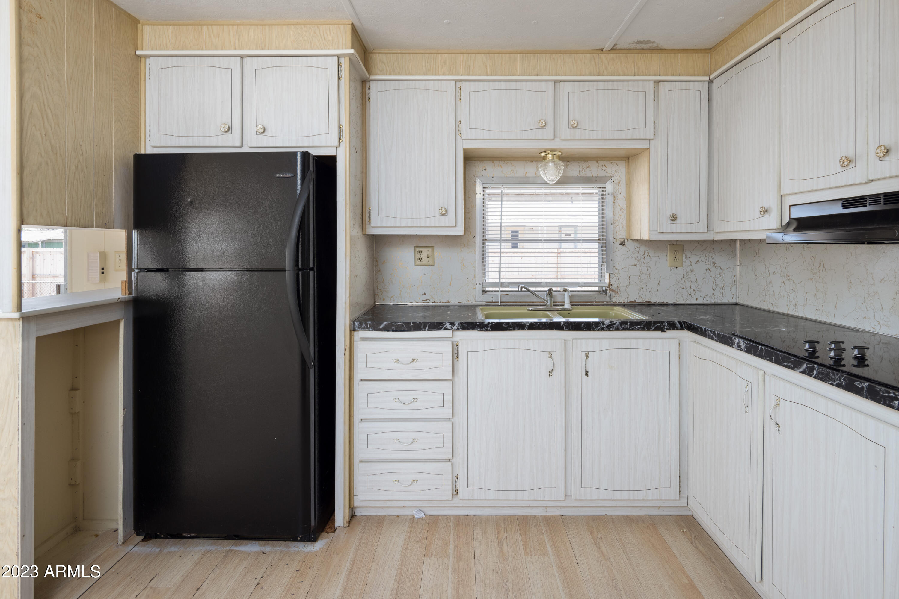 9618 East Aspen Circle Mesa, AZ 85208 - Photo 12 of 30 a kitchen with white cabinets and refrigerator