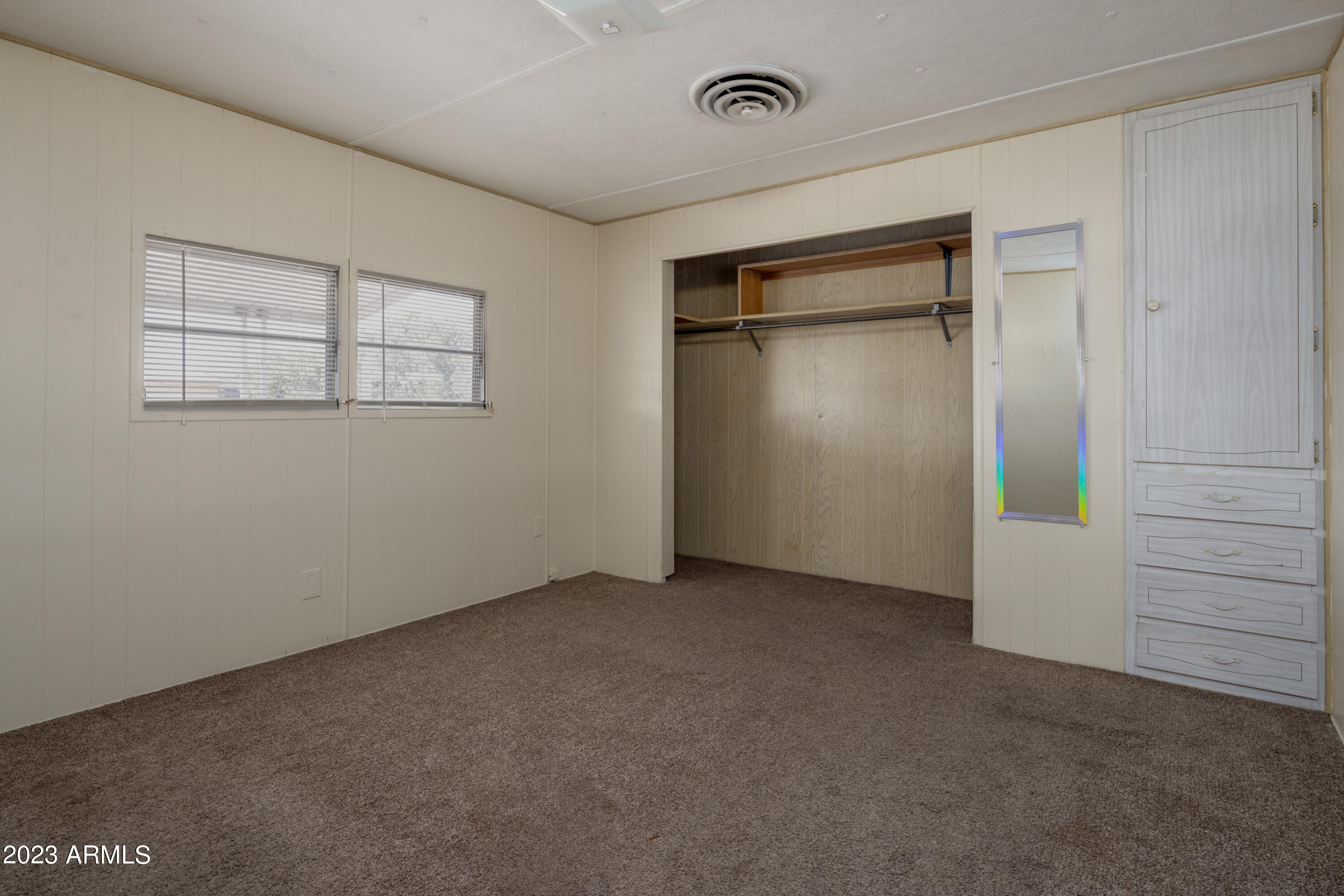 9618 East Aspen Circle Mesa, AZ 85208 - Photo 19 of 30 an empty room with closet area