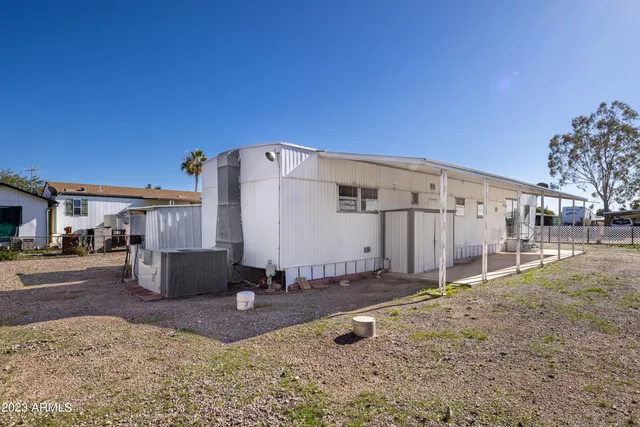 an empty room with closet area