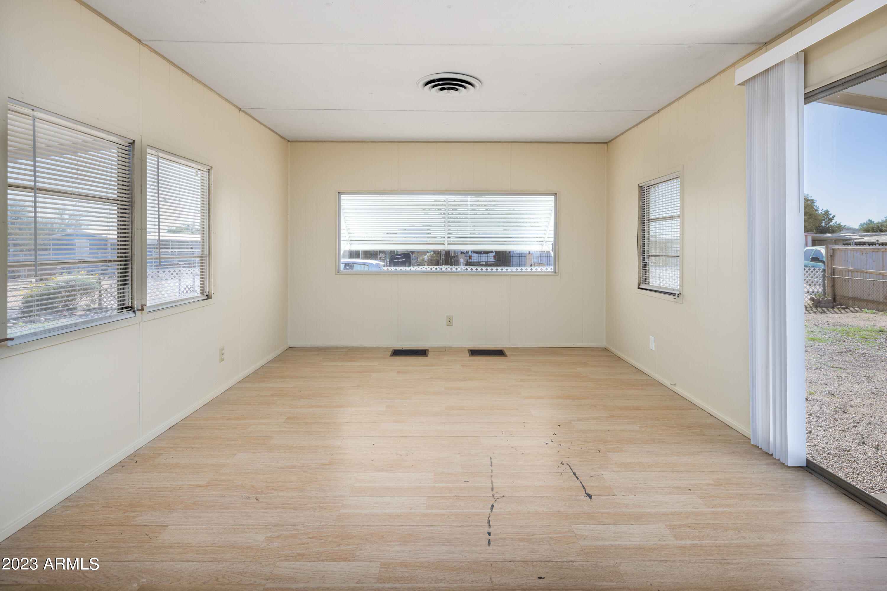 9618 East Aspen Circle Mesa, AZ 85208 - Photo 9 of 30 a view of an empty room with a window