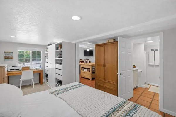 a bedroom with a bed and furniture