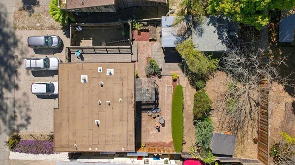 front view of a house with a tree