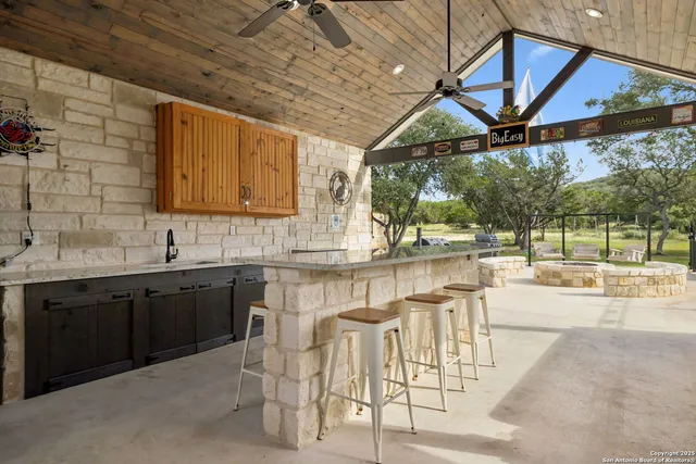 a kitchen with table and chairs
