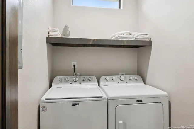 a utility room with dryer and washer