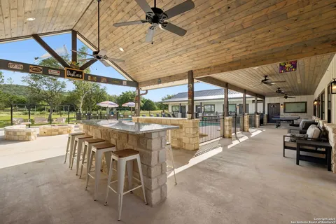 a view of a patio with table and chairs