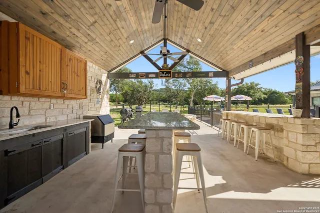 a open kitchen with stainless steel appliances granite countertop a stove and cabinets