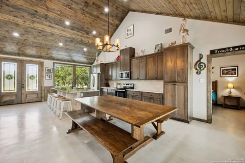 a kitchen with sink and refrigerator