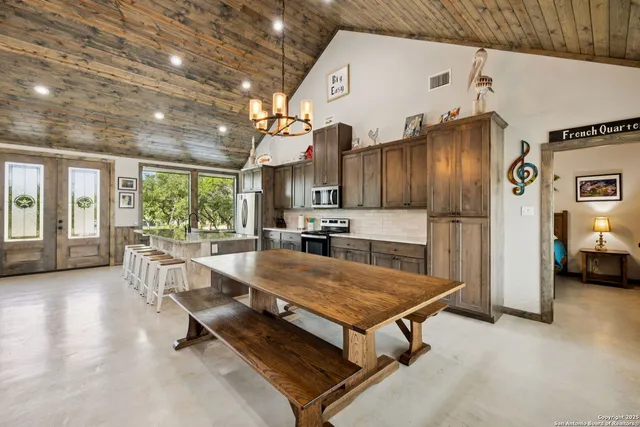 a kitchen with sink and refrigerator