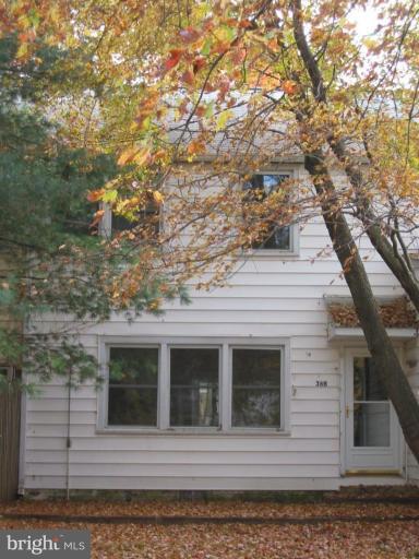 a view of a house with a tree