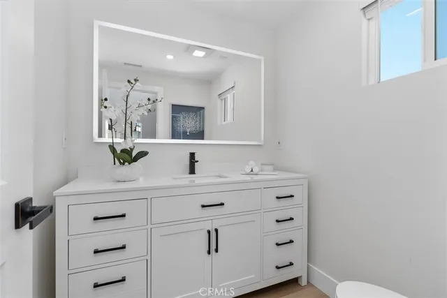 a bathroom with a toilet sink a shower and