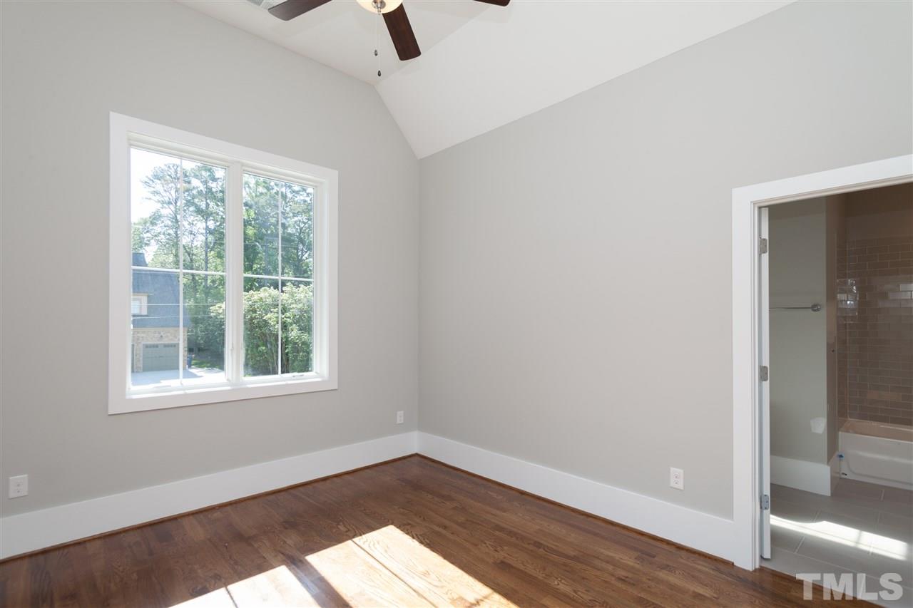 1105 Dogwood Lane Raleigh, NC 27607 - Photo 22 of 25 an empty room with window and wooden floor