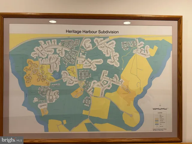 a close up of a sink and a potted plant