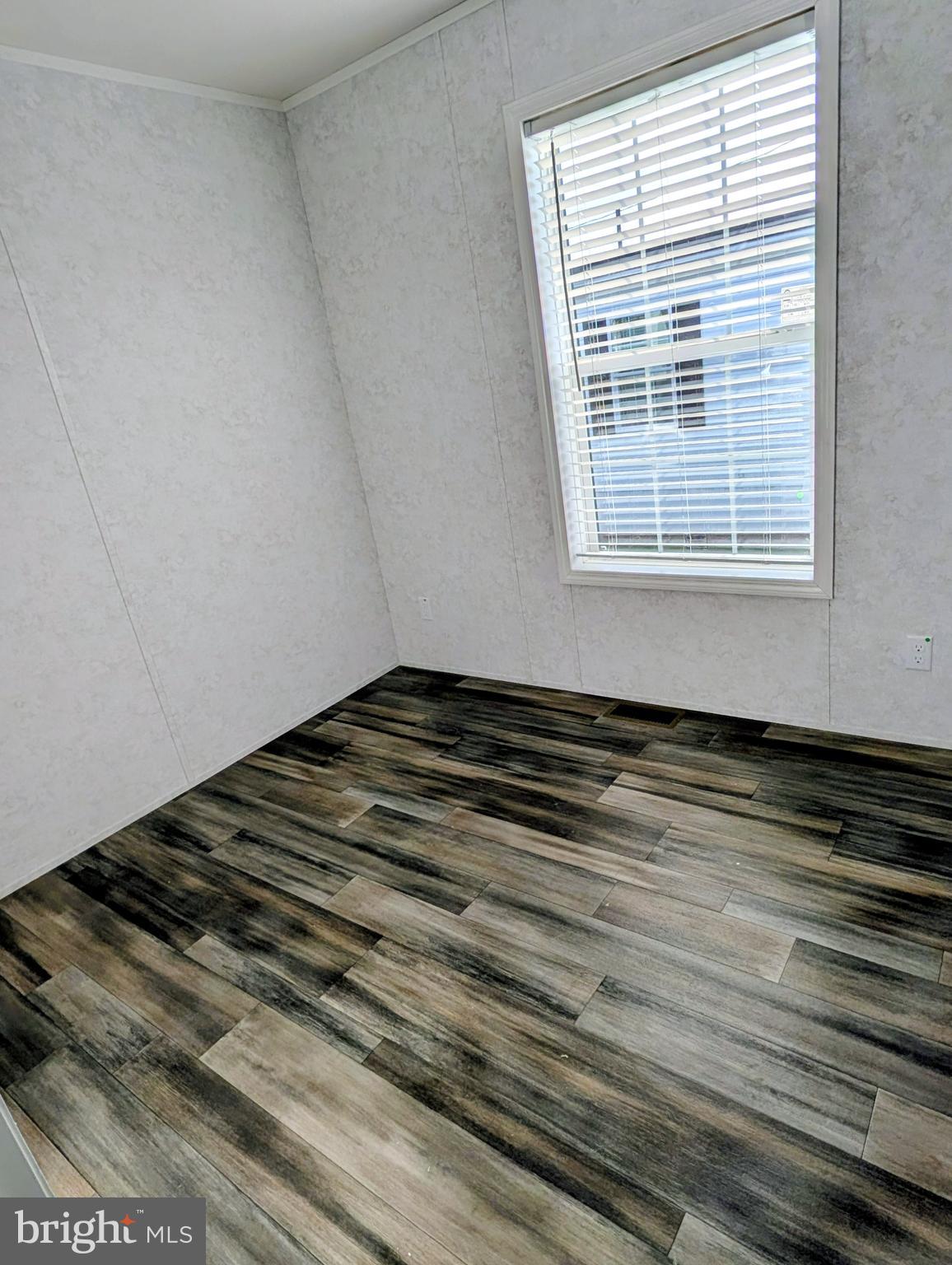 16 Abbey Road Coatesville, PA 19320 - Photo 7 of 8 a view of a room with wooden floor and a window
