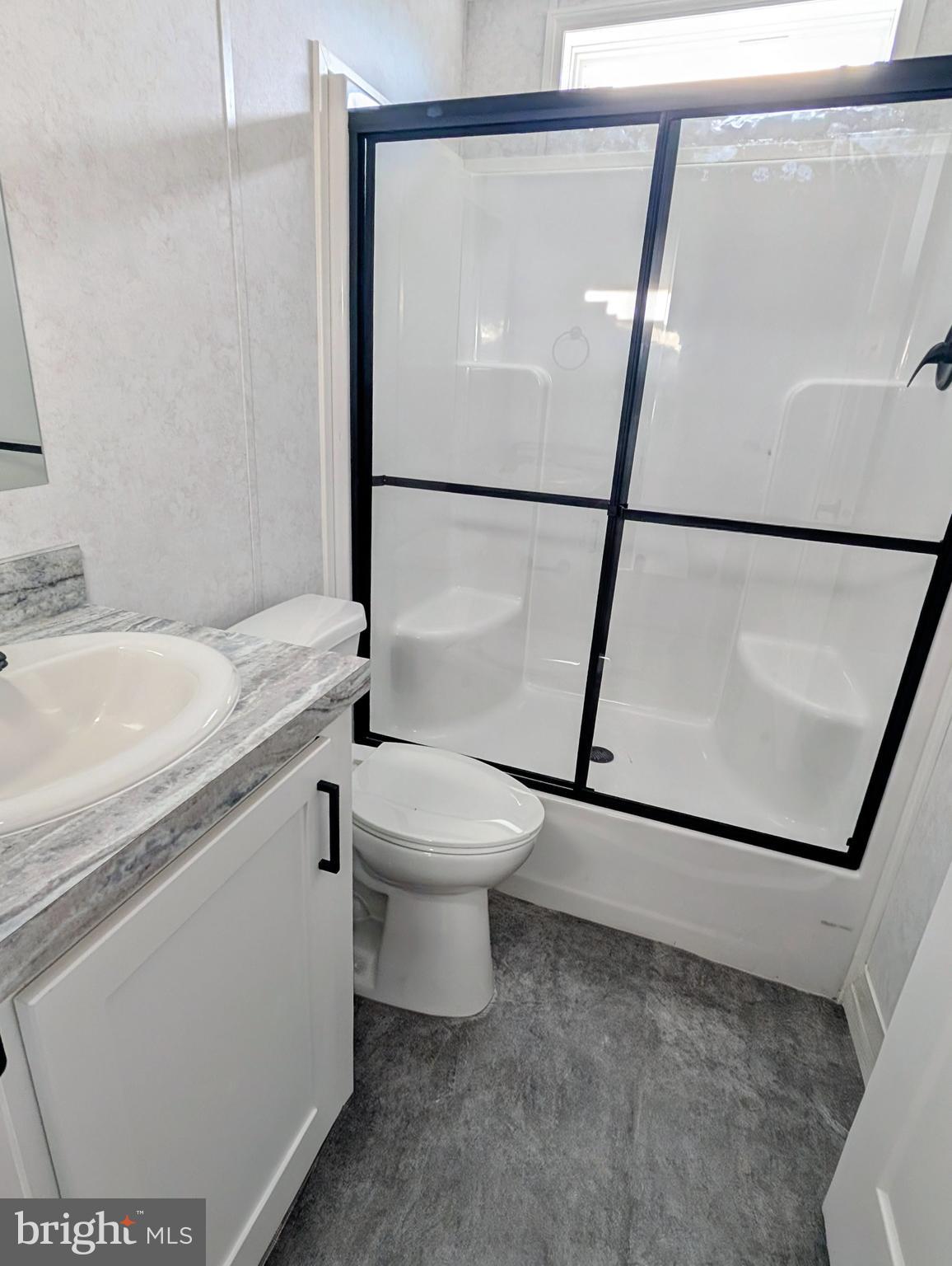 16 Abbey Road Coatesville, PA 19320 - Photo 8 of 8 a bathroom with a sink a toilet and shower