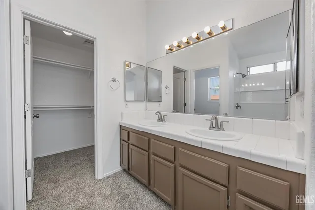 a view of empty room with ceiling fan