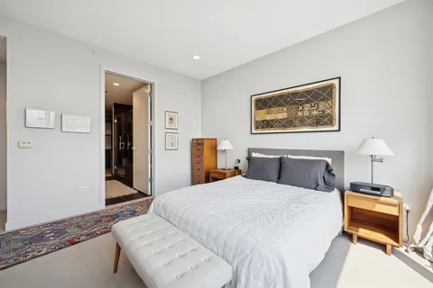 a bedroom with a bed and a couch