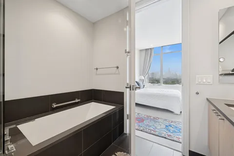 a bathroom with a bathtub and a sink
