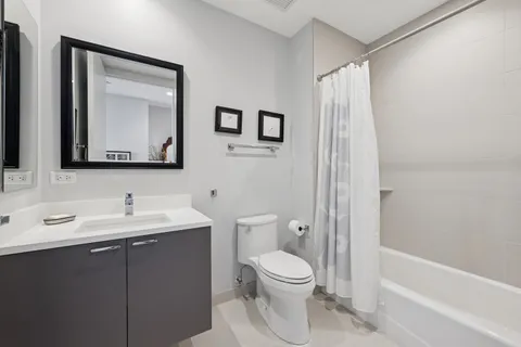a bathroom with a toilet a sink and a bathtub