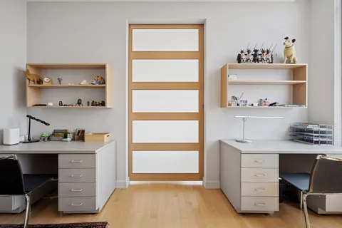 a bathroom with a toilet a sink and a mirror