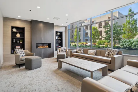 a view of a patio with plants and chairs