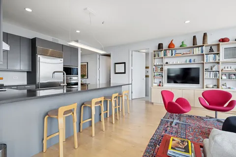 a living room with furniture and flat screen tv