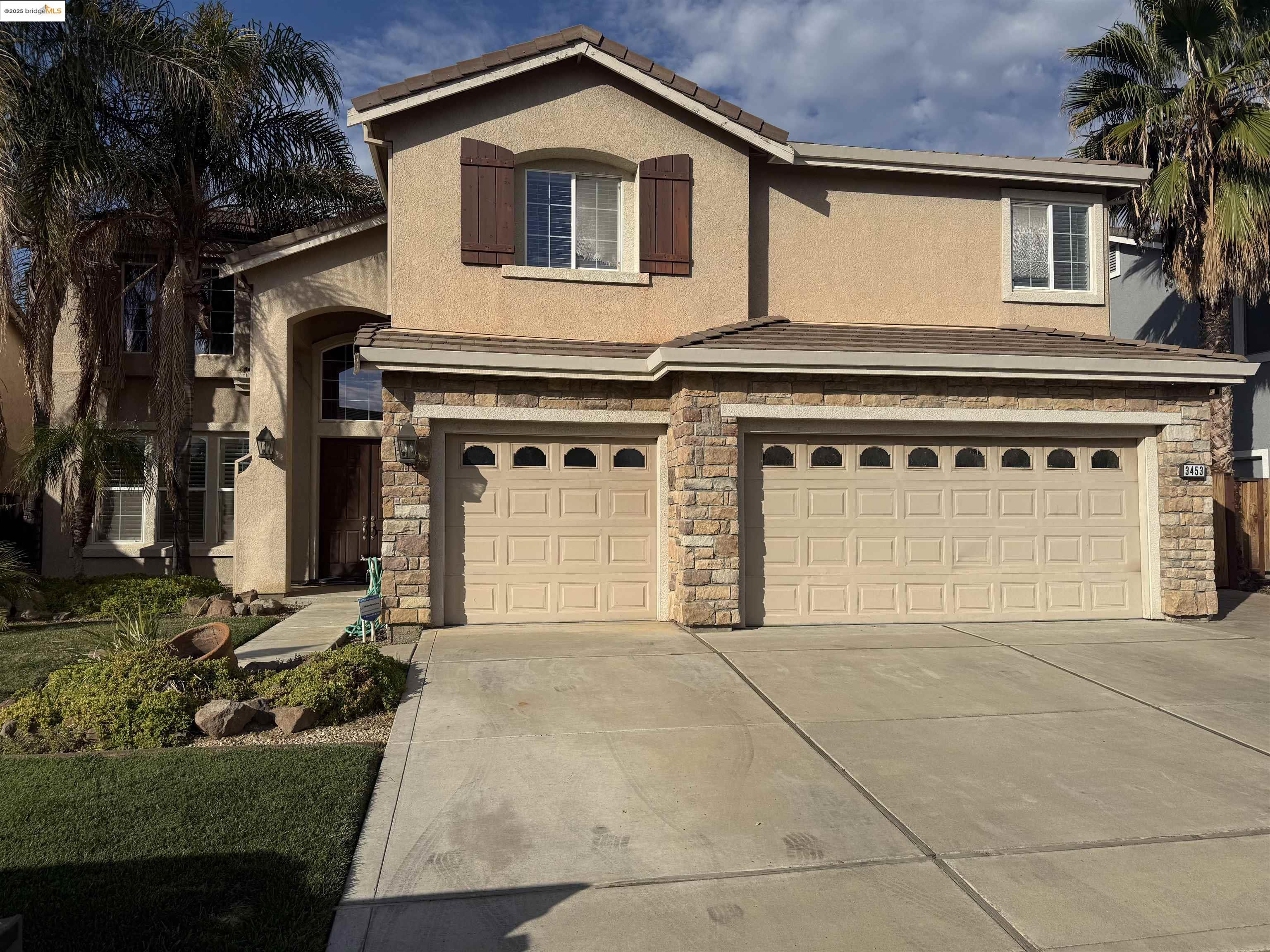3453 Keystone Loop Discovery Bay, CA 94505 - Photo 1 of 1 a front view of a house with a yard and garage