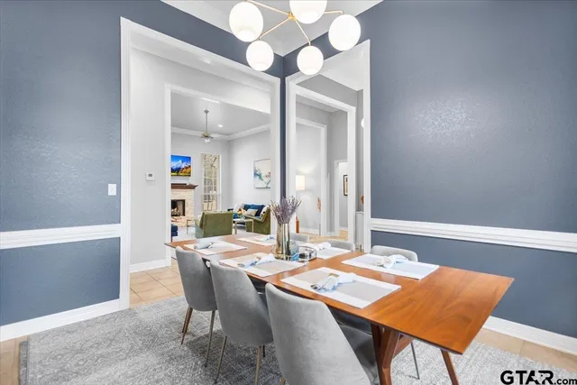 a dining room with a table and chairs