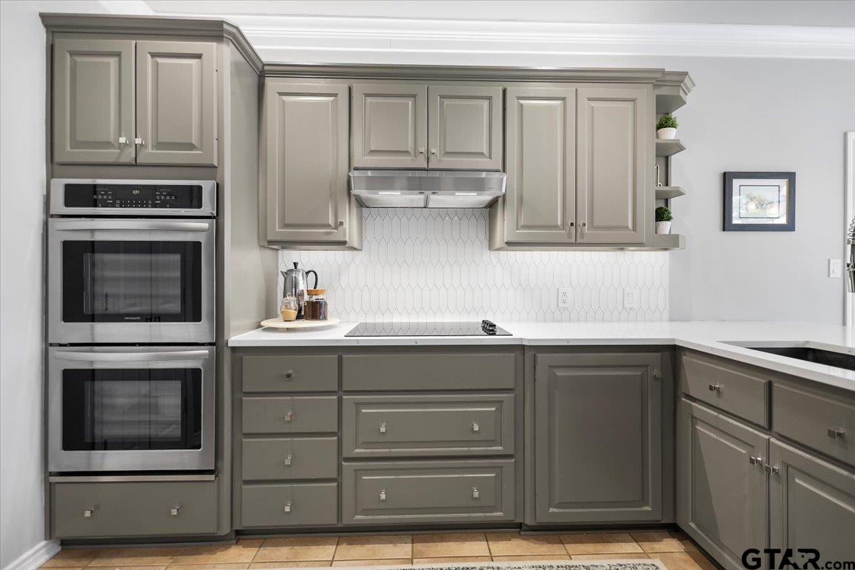 17679 Briarpatch Lindale, TX 75771 - Photo 15 of 47 a kitchen with stainless steel appliances granite countertop a stove and a microwave