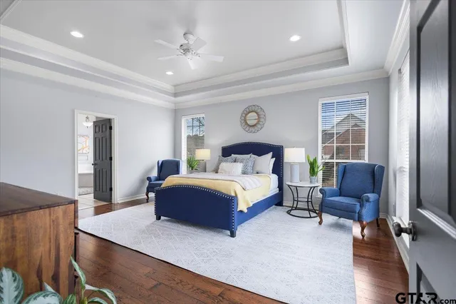 a bedroom with a bed and a couch