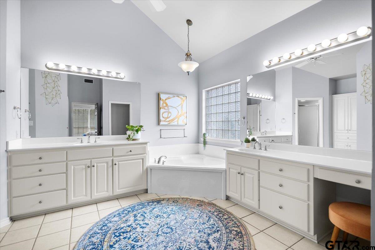 17679 Briarpatch Lindale, TX 75771 - Photo 22 of 47 a spacious bathroom with a double vanity sink mirror and bathtub