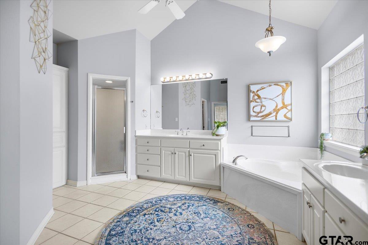 17679 Briarpatch Lindale, TX 75771 - Photo 23 of 47 a spacious bathroom with a sink a large mirror and a bathtub