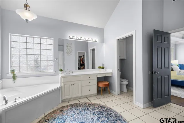 a bathroom with a bathtub sink and toilet