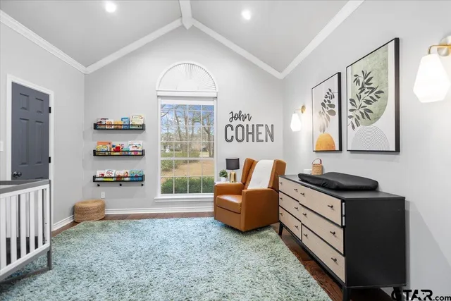 a bedroom with furniture and a window