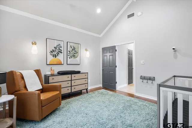 a spacious bedroom with a bed and a couch