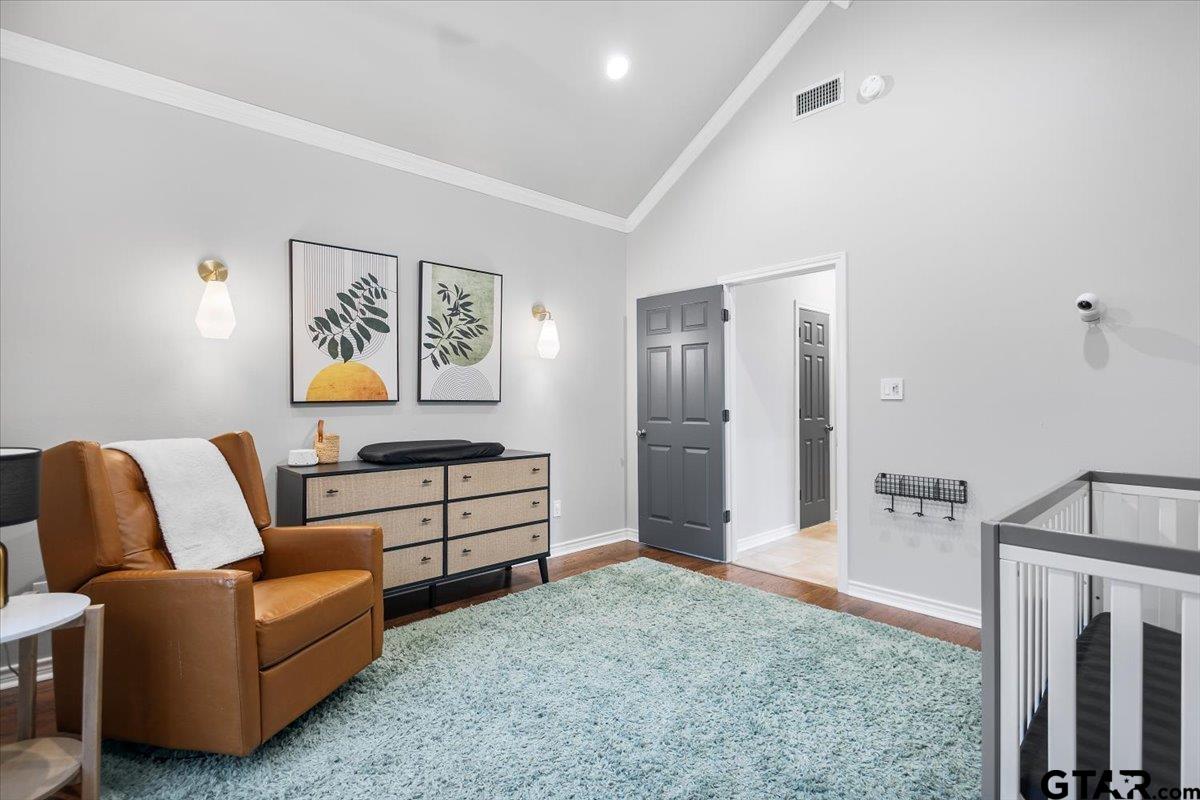 17679 Briarpatch Lindale, TX 75771 - Photo 28 of 47 a spacious bedroom with a bed and a couch