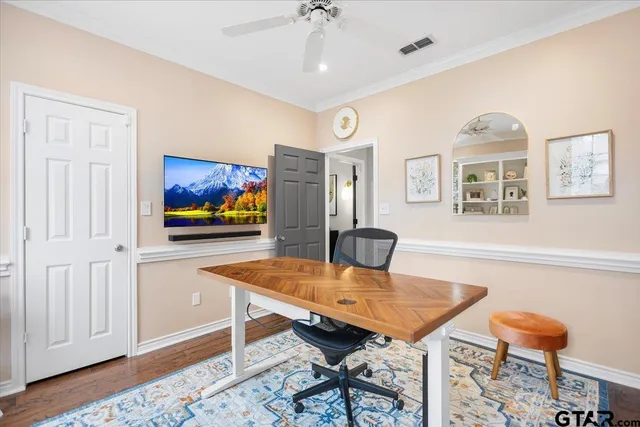 a view of a dining room with furniture a chandelier and wooden floor