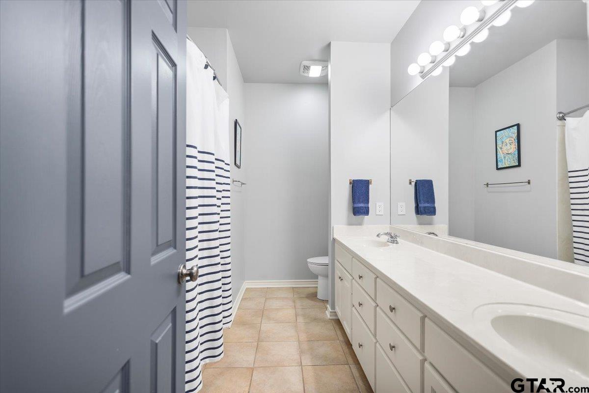 17679 Briarpatch Lindale, TX 75771 - Photo 31 of 47 a spacious bathroom with a double vanity sink a large mirror and a shower