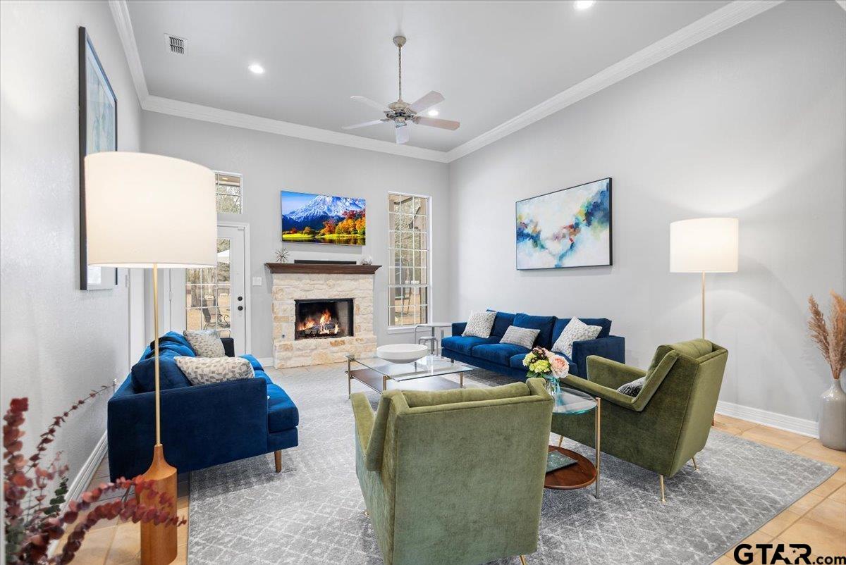 17679 Briarpatch Lindale, TX 75771 - Photo 9 of 47 a living room with furniture a flat screen tv and a fireplace