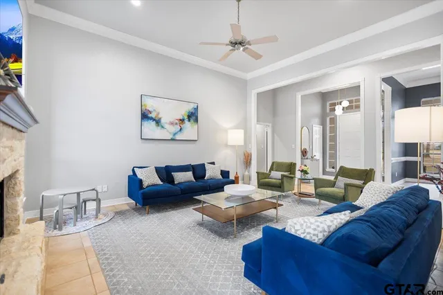 a living room with furniture and a fireplace