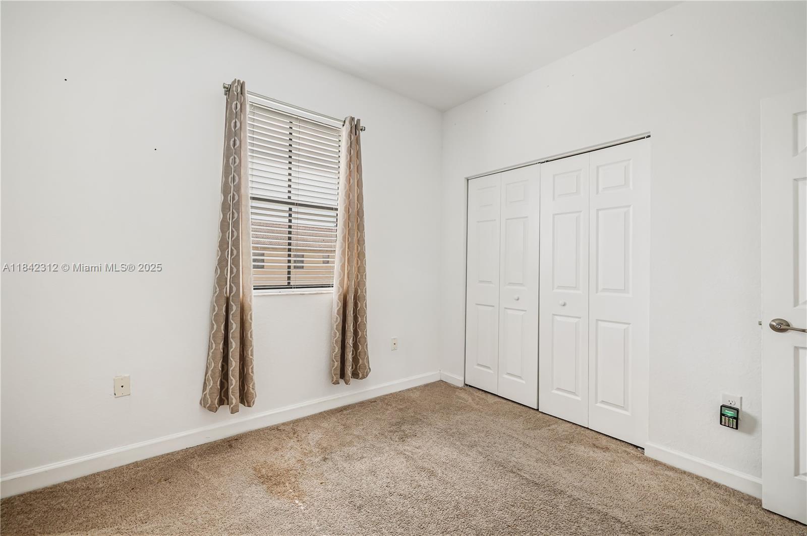 23634 Southwest 117 Place Homestead, FL 33032 - Photo 15 of 31 an empty room with windows