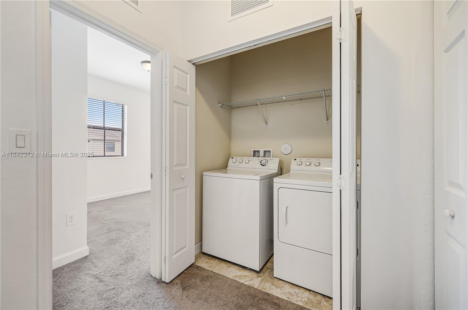 23634 Southwest 117 Place Homestead, FL 33032 - Photo 20 of 31 a utility room with dryer and washer